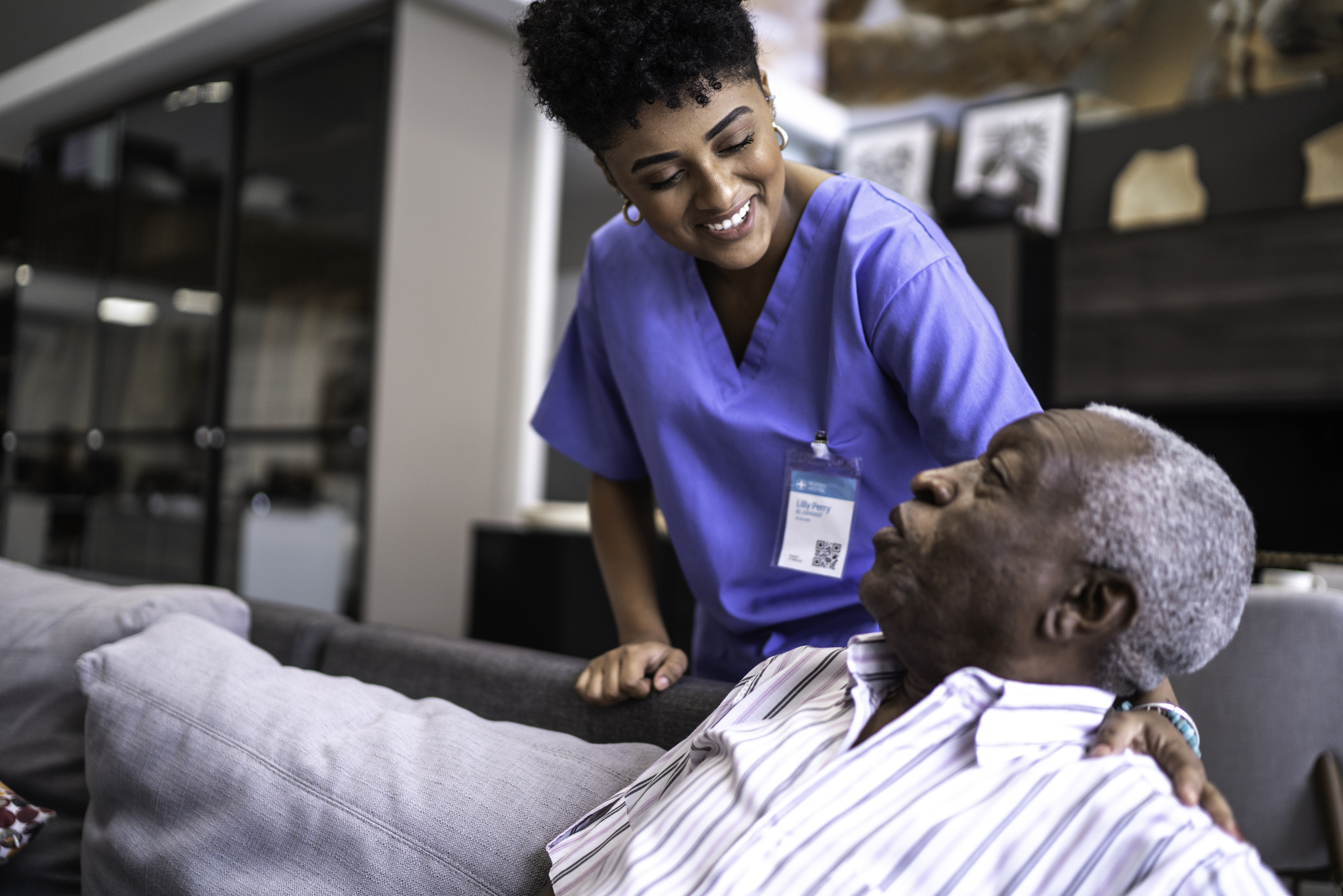 Female nurse taking care of a senior man