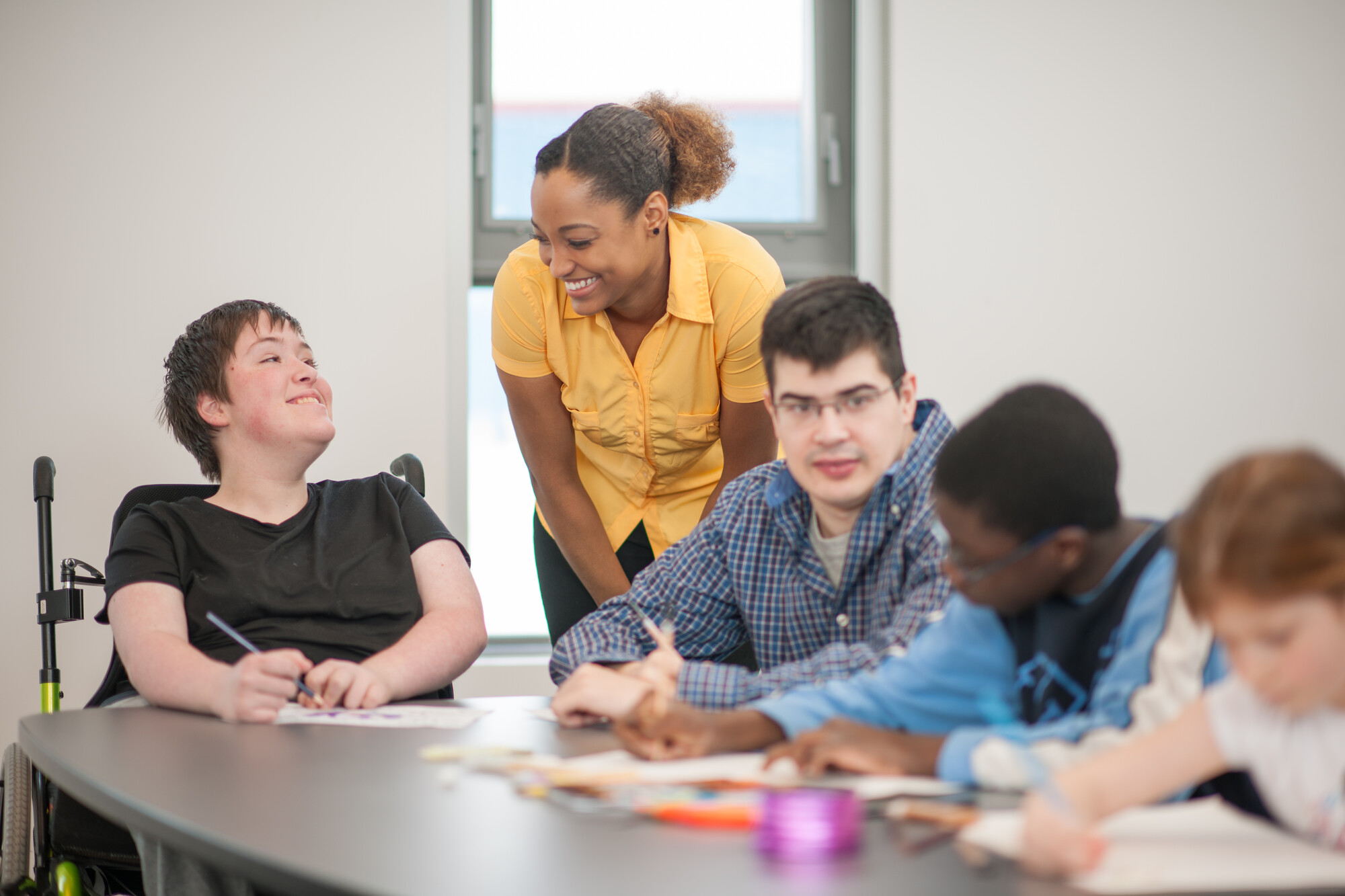 Find definitions of transition from children's services into adulthood and how Hospice UK is responding to young people's needs with research, guidance and project funds