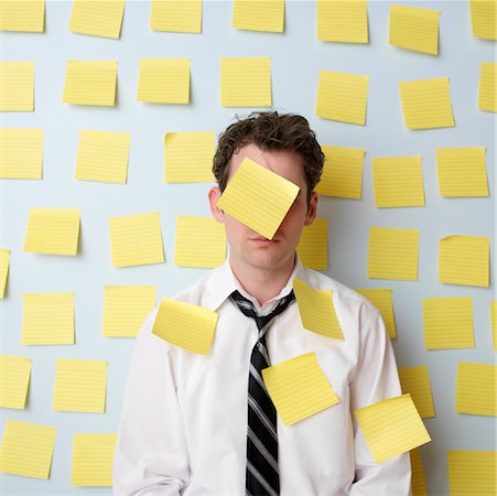 A stock photo of someone with a lot of post-it notes