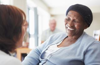 A stock photo of someone being supported by a carer