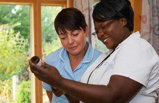 Your guide to hospice care and end of life care (image: two hospice nurses working in a hospice)