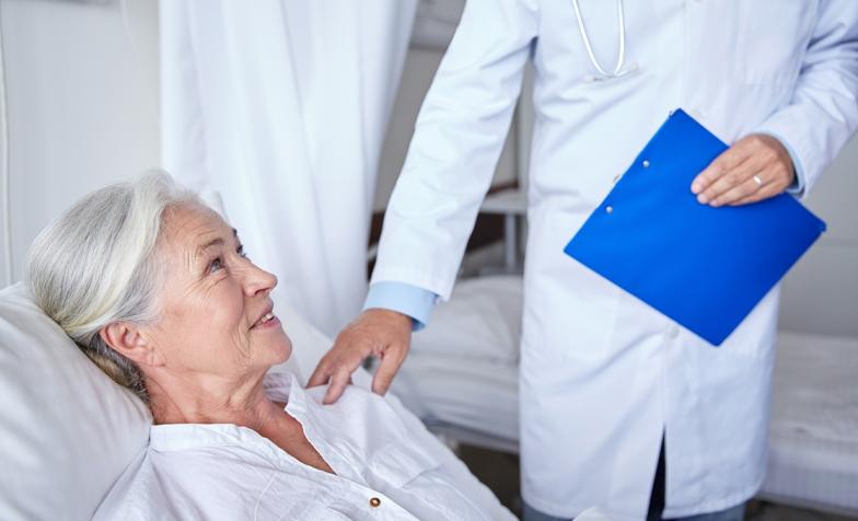 Hospice worker attending patient