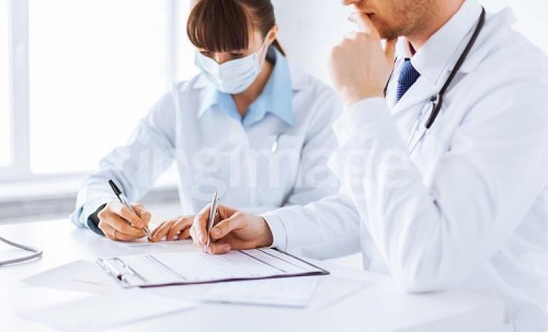 Doctors writing notes