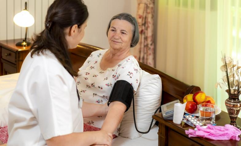 A stock photo of someone being cared for in their own home