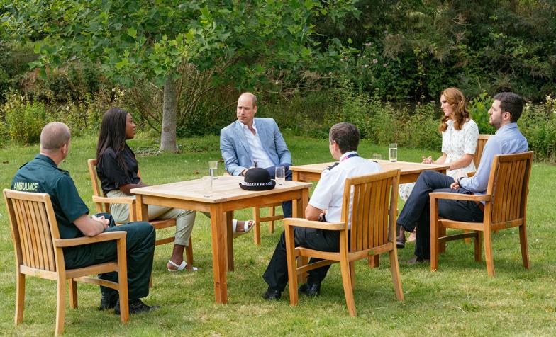 The Duke and Duchess of Cambridge with frontline workers sitting outside 