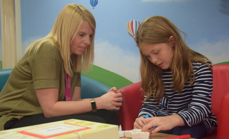 Bereavement counsellor and young girl