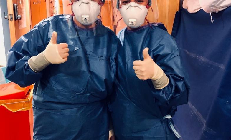 Specialist nurses of St Luke's Plymouth in full PPE with thumbs up