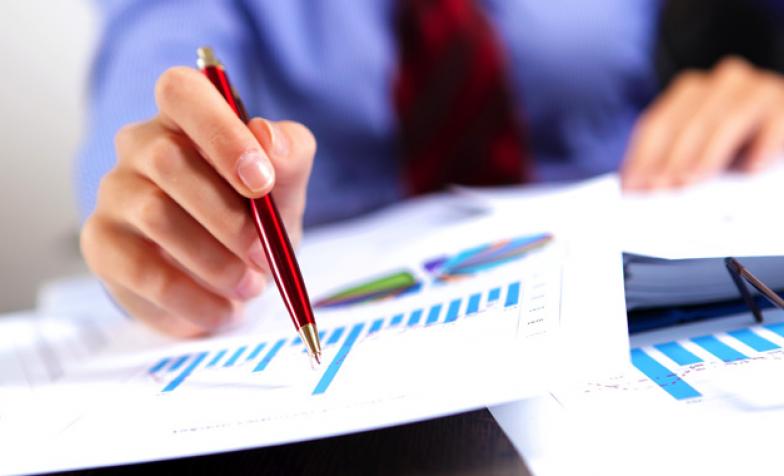 A stock photo of someone checking finance reports