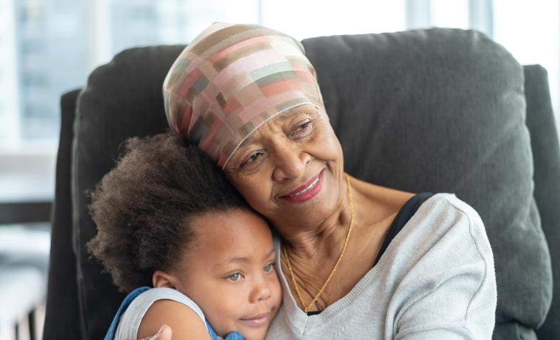 Grandmother holds her young granddaughter