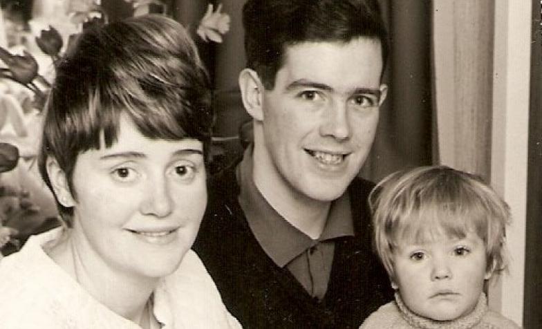 An old photo of Lisa as a baby and her parents