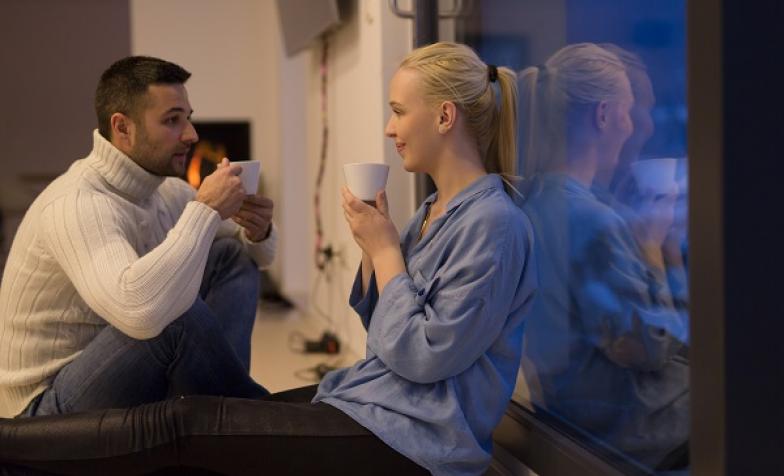 Relaxed couple drinking coffee