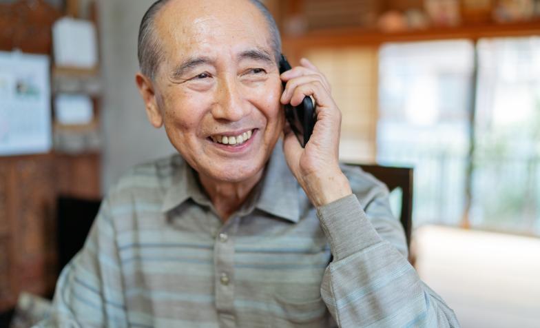 Older Asian man on phone