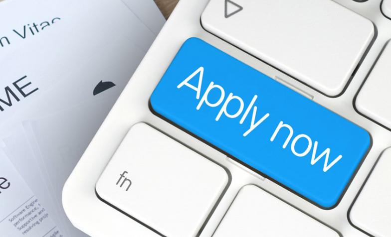 Picture of a keyboard with Apply now written on it
