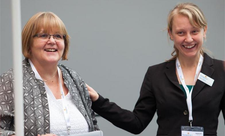 Two members of Hospice UK staff at the National Conference