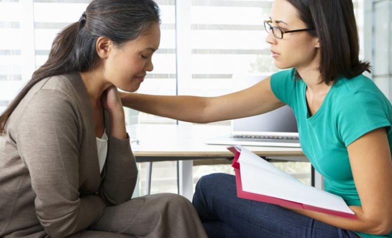 Stock Photo of a women offering support to another women
