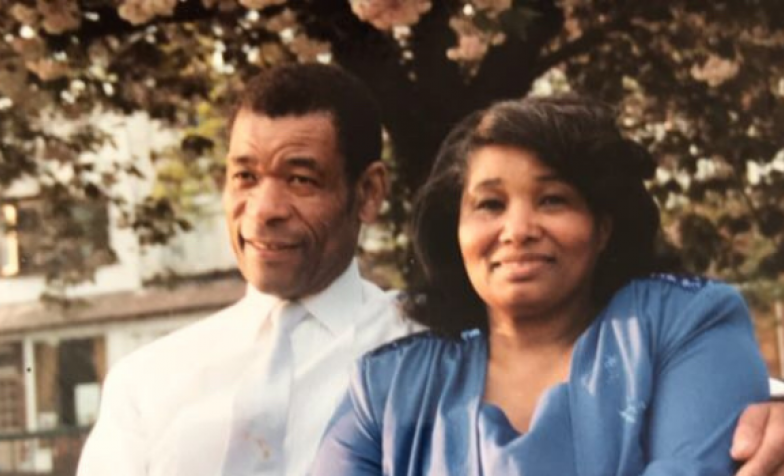 Maureen's parents sitting on a bench
