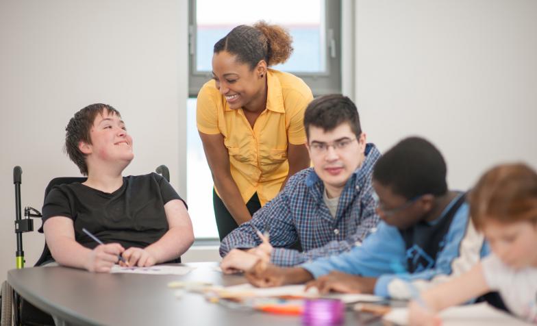Find definitions of transition from children's services into adulthood and how Hospice UK is responding to young people's needs with research, guidance and project funds