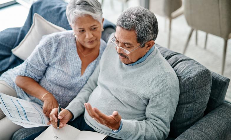 Elderly couple writing a will together