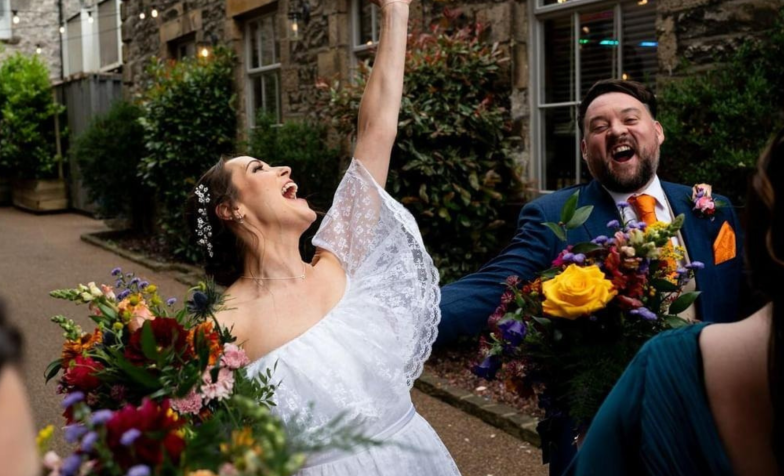 Bride and groom cheering