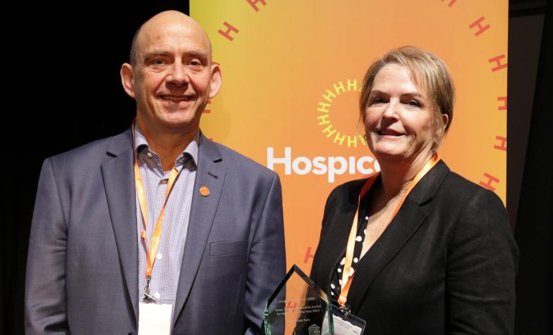 Rachel Overfield, CEO of Compton Care Hospice, collects the Anne, Duchess of Norfolk Volunteer of the Year Award 2024 on behalf of Harbhajan Surj