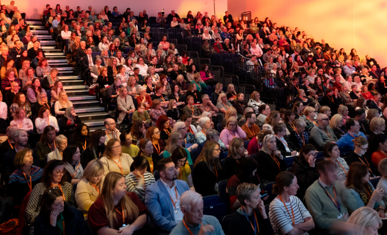 An auditorium full of people