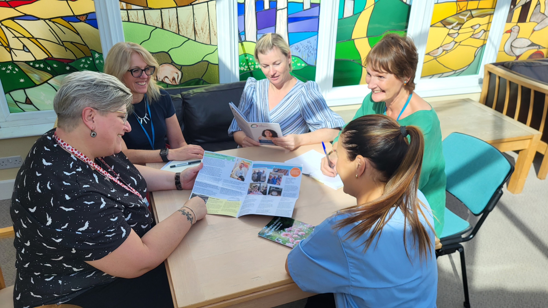 St Michael's Hospice team discussing their plans