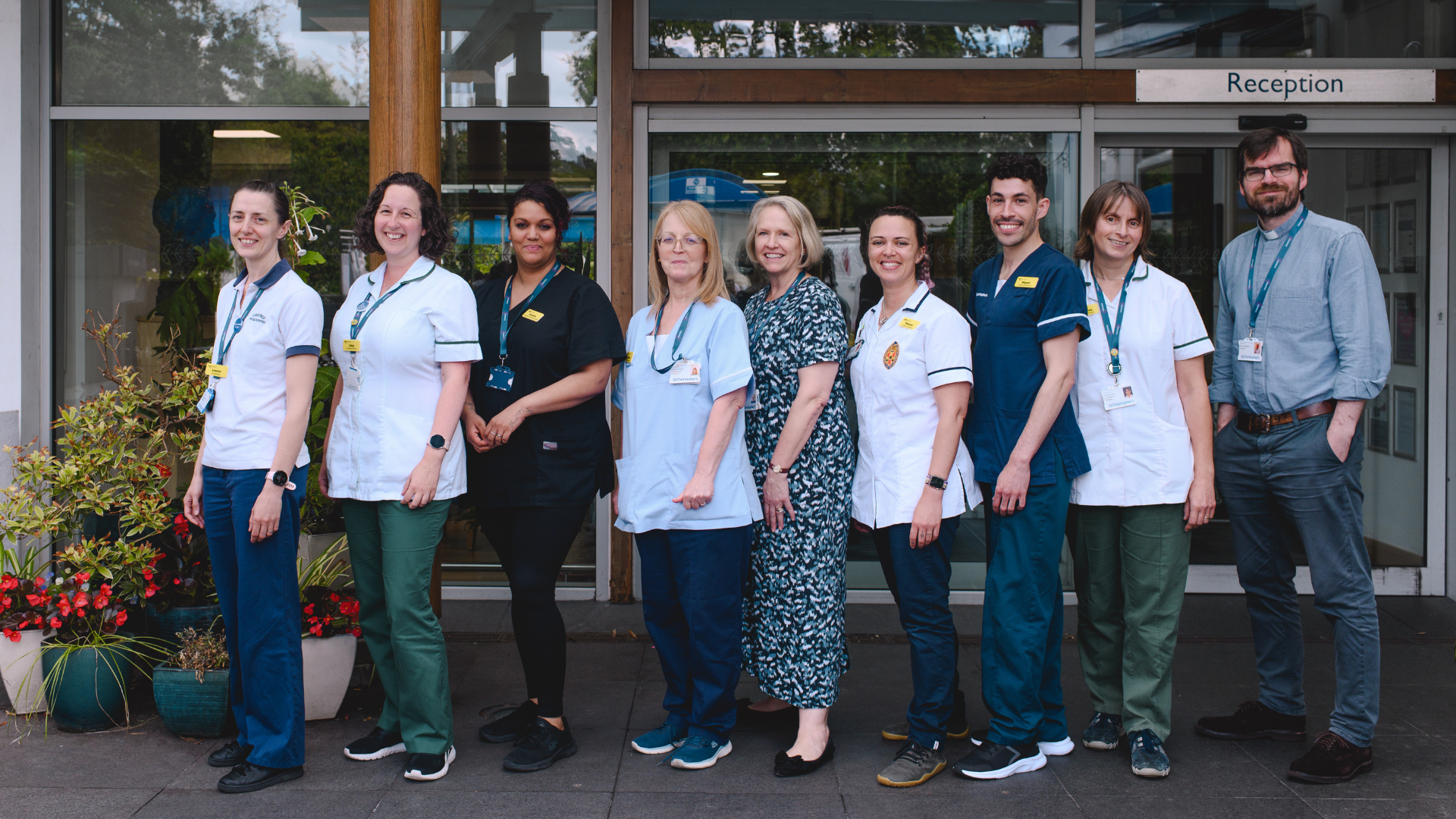 Staff at St Christopher's Hospice standing outside the hospice reception