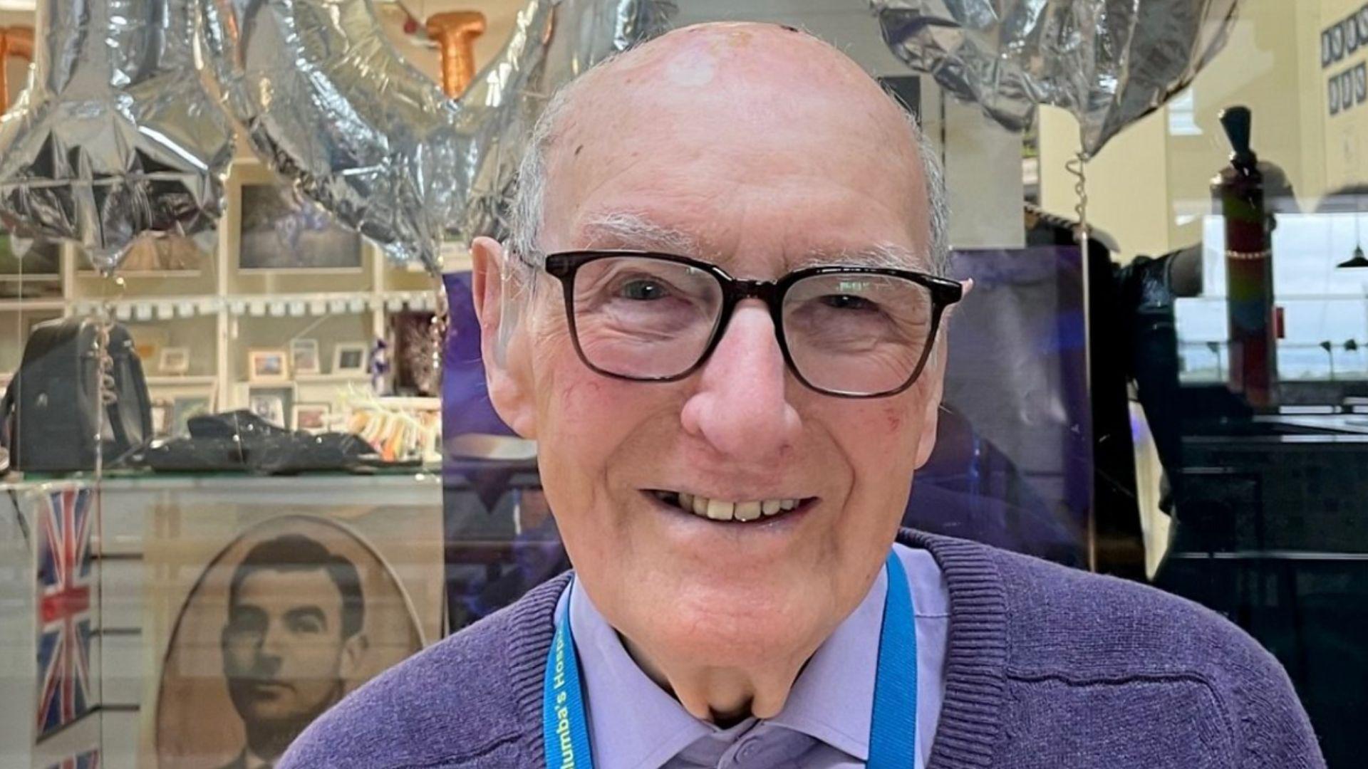 102 year old man smiling into the camera