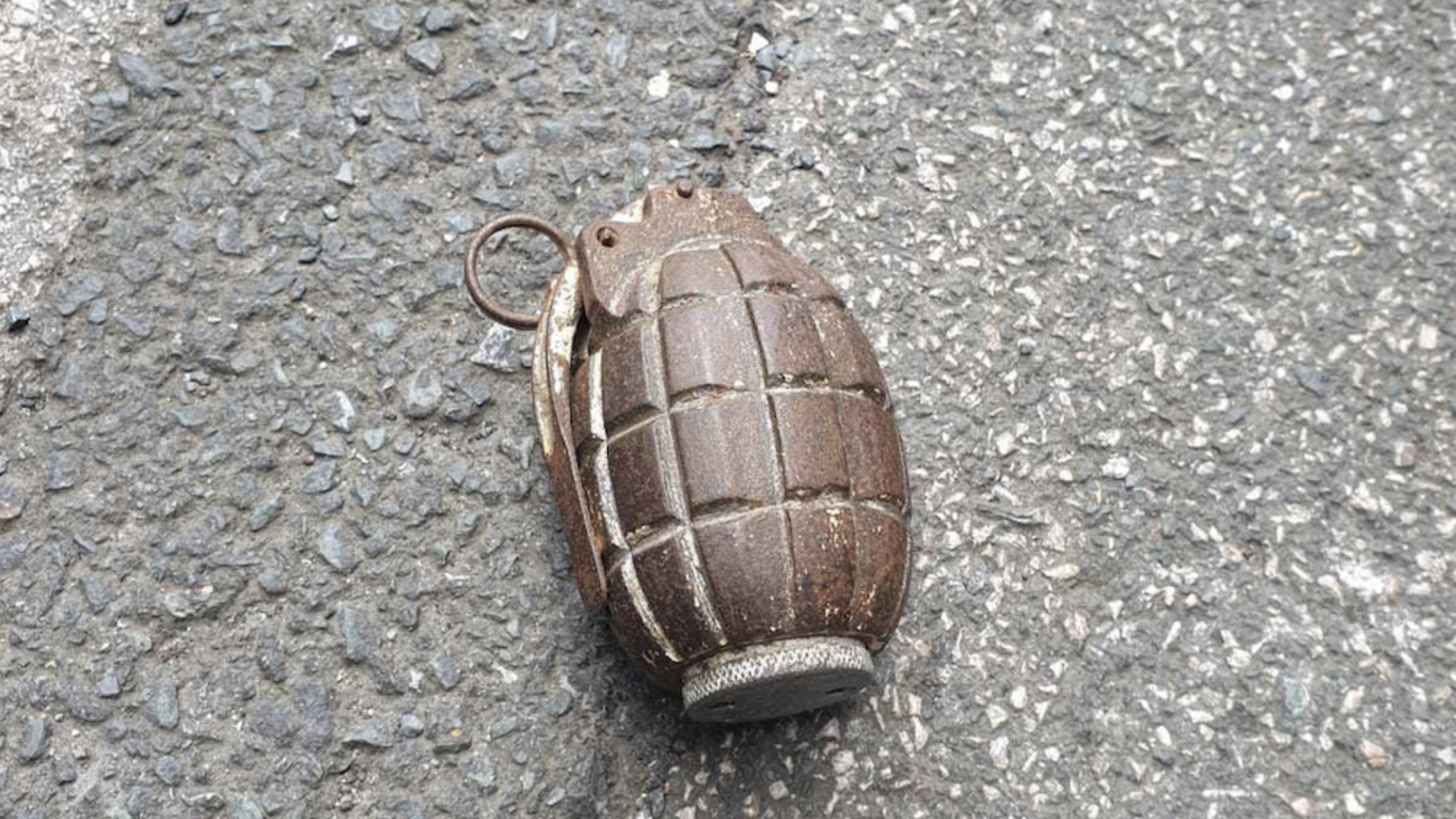 A grenade lying on the pavement
