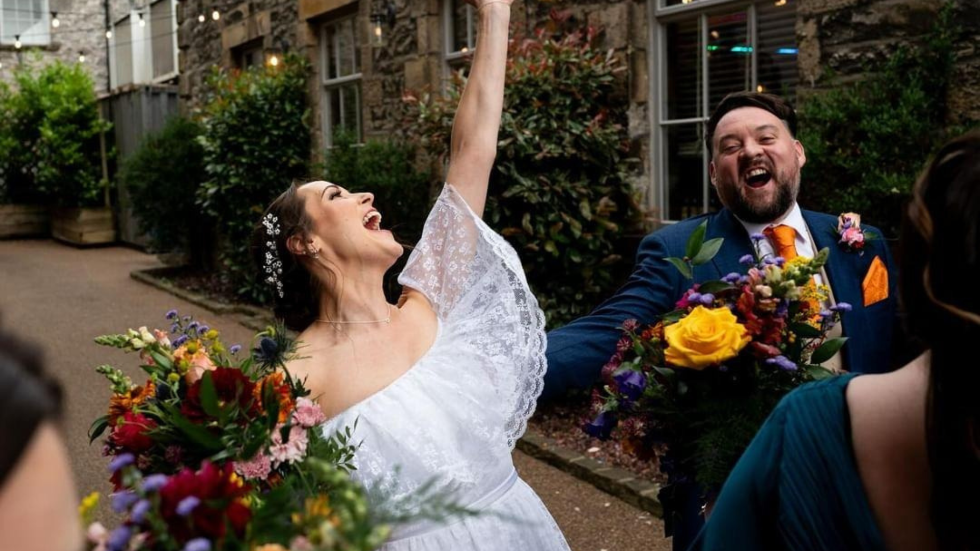 Bride and groom cheering