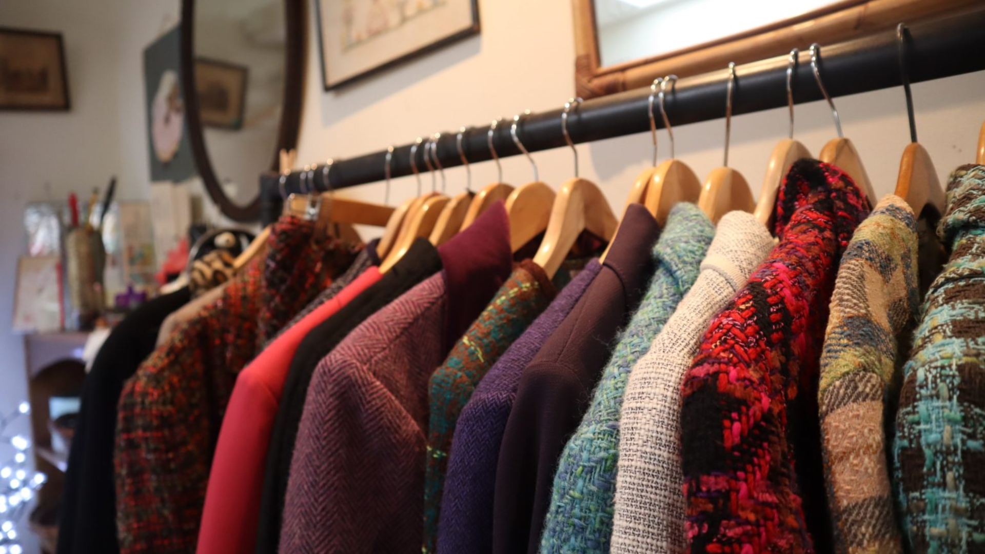 A selection of jackets hanging on a clothing rail