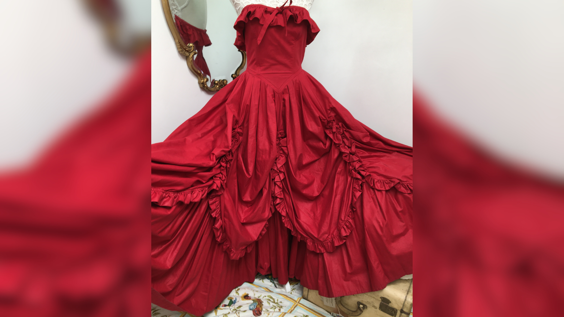 A red gown hung on a mannequin