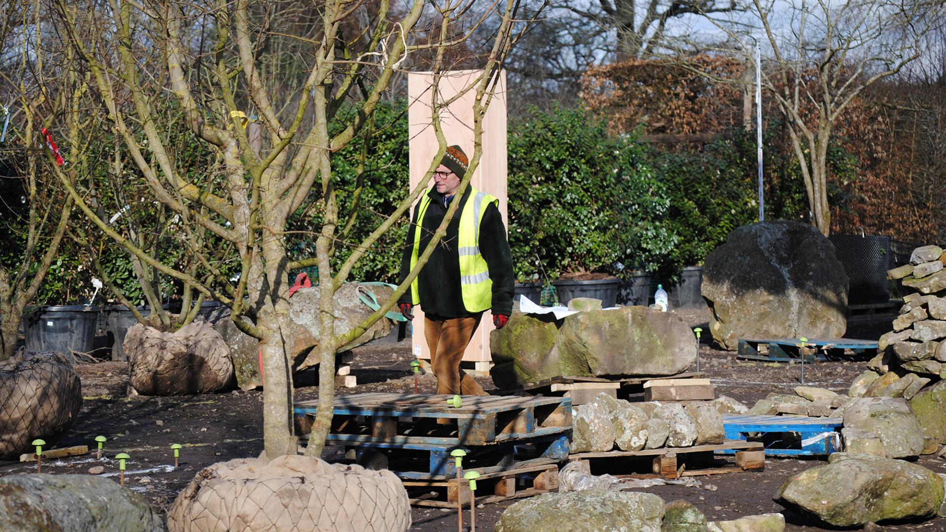The Hospice UK Garden of Compassion designer, Tom Hoblyn, in his element during the trial build at Hortus Loci