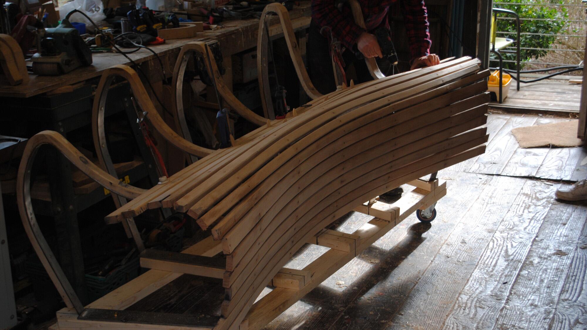 Copper rivets are hammered into the oak for the Together Benches