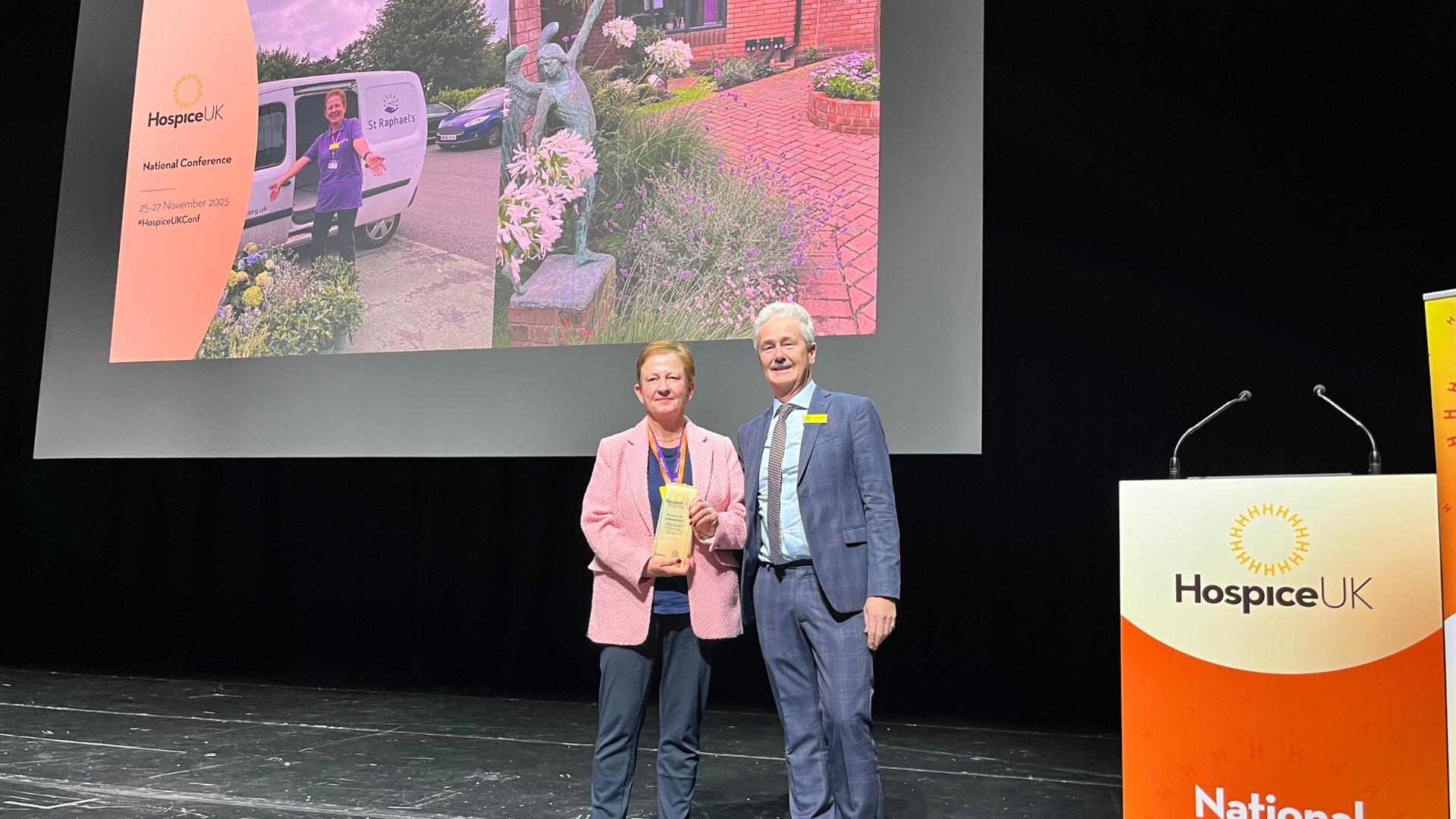 Penny Hall receiving her award from National Garden Scheme Chair, Rupert Tyler