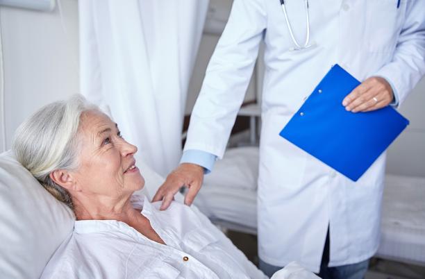 Hospice worker attending patient