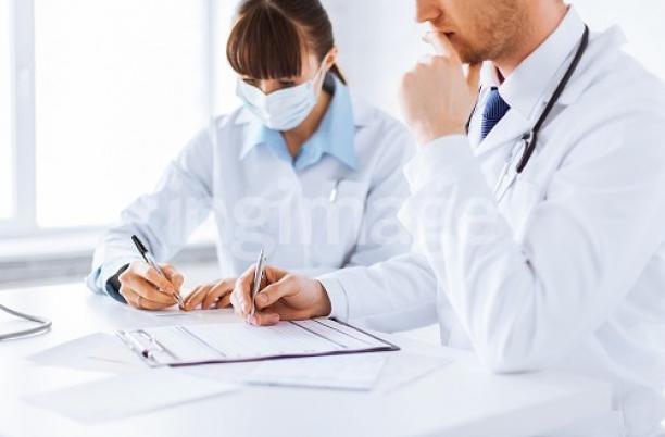 Doctors writing notes