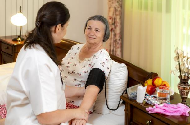 A stock photo of someone being cared for in their own home