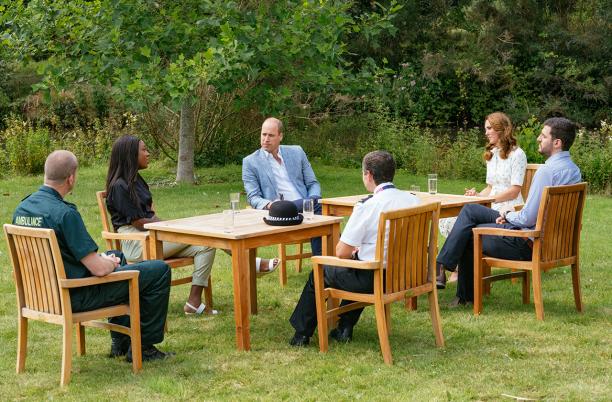 The Duke and Duchess of Cambridge with frontline workers sitting outside 