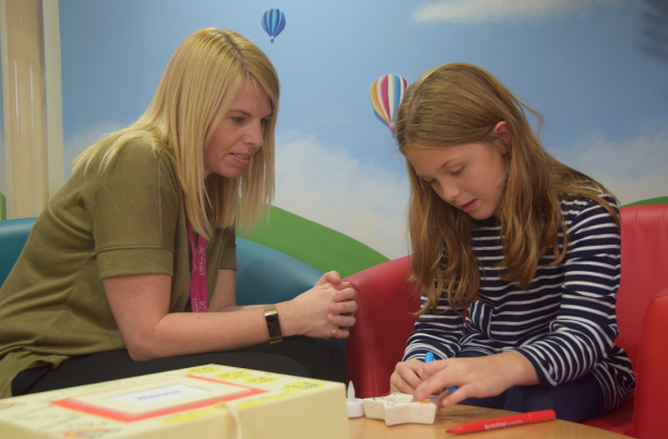 Bereavement counsellor and young girl
