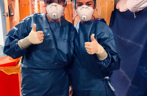 Specialist nurses of St Luke's Plymouth in full PPE with thumbs up