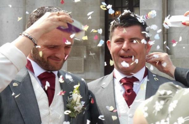 Gay couple getting married with confetti celebration 