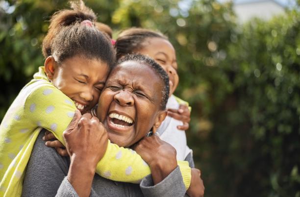 Woman laughing with her children
