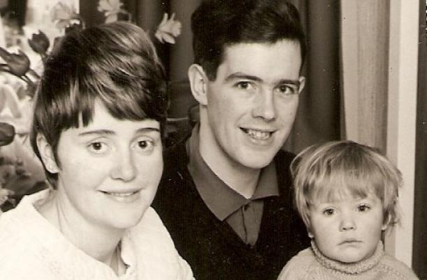 An old photo of Lisa as a baby and her parents