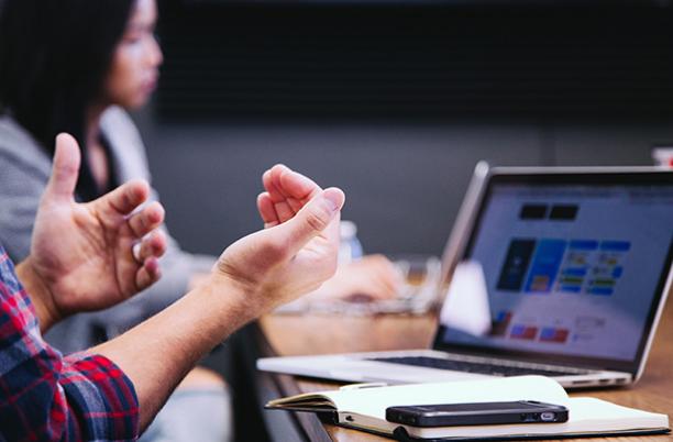 A stock photo of a Board meeting on a laptop