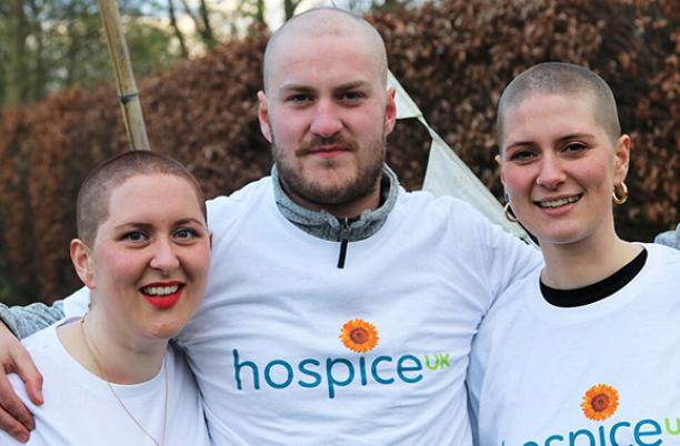 Photo of three people who braved a headshave for Hospice UK