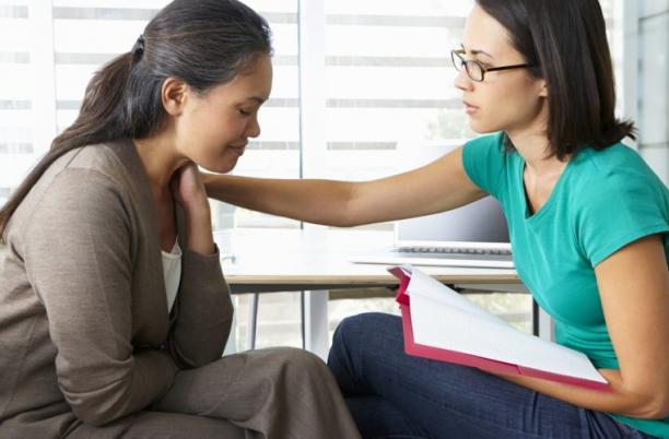 Stock Photo of a women offering support to another women