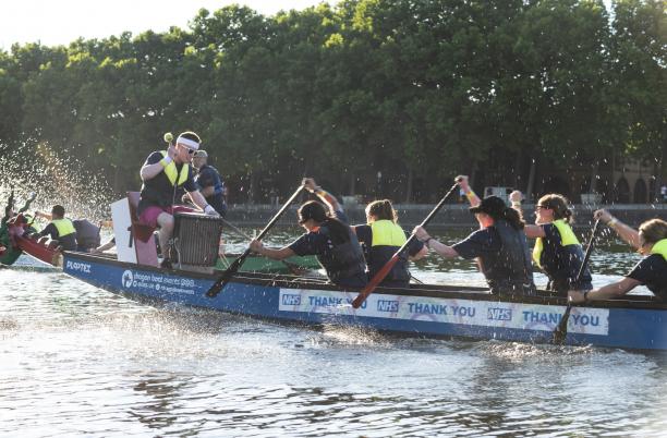 Dragon Boat Race team racing across water