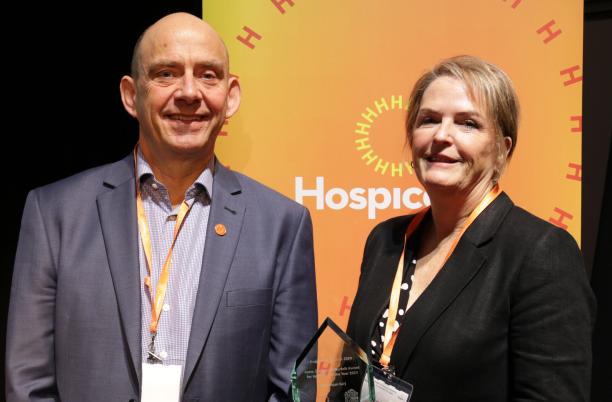 Rachel Overfield, CEO of Compton Care Hospice, collects the Anne, Duchess of Norfolk Volunteer of the Year Award 2024 on behalf of Harbhajan Surj