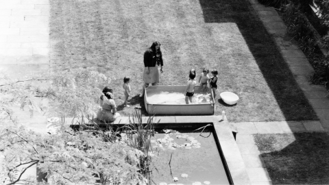 Family enjoying time outside in the early days of St Christopher's Hospice